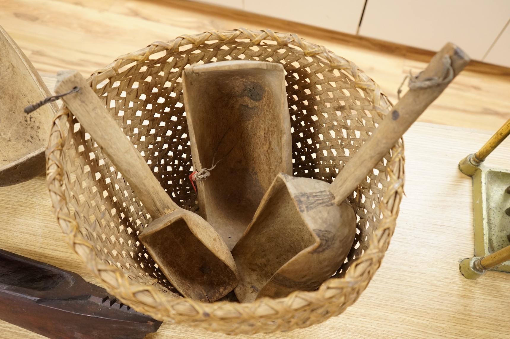 Tribal interest; A collection of various African carvings, a basket and spear
